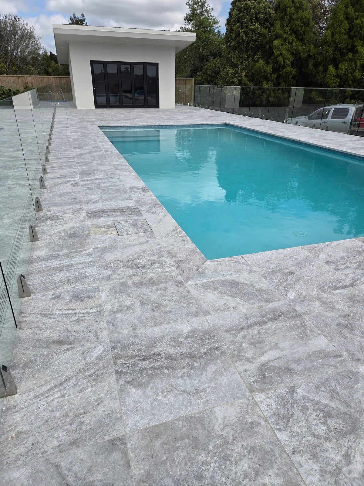 Porcelain paving and coping around a pool