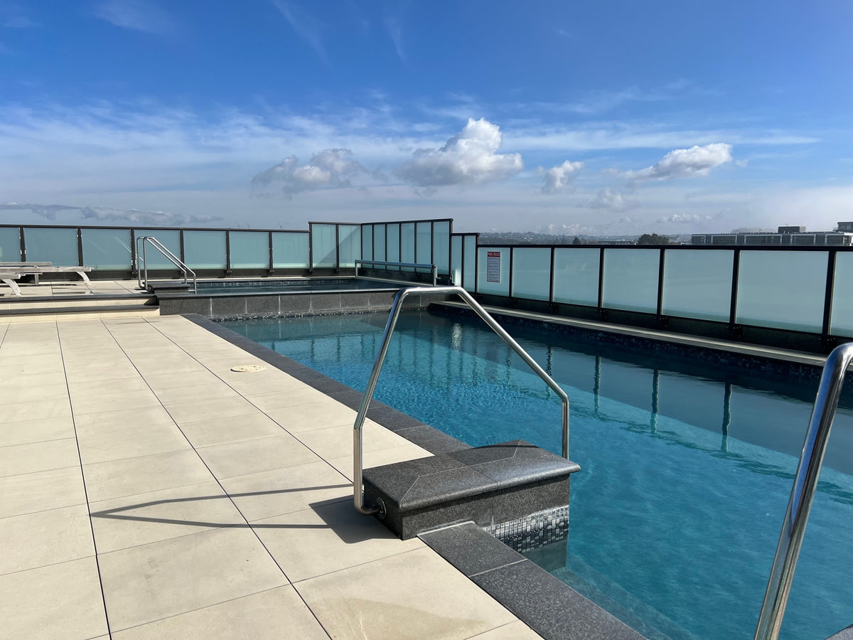 Black granite bullnose coping on a rooftop pool step