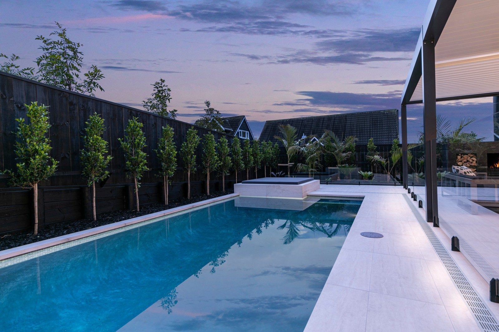 Pool deck beside glass fencing